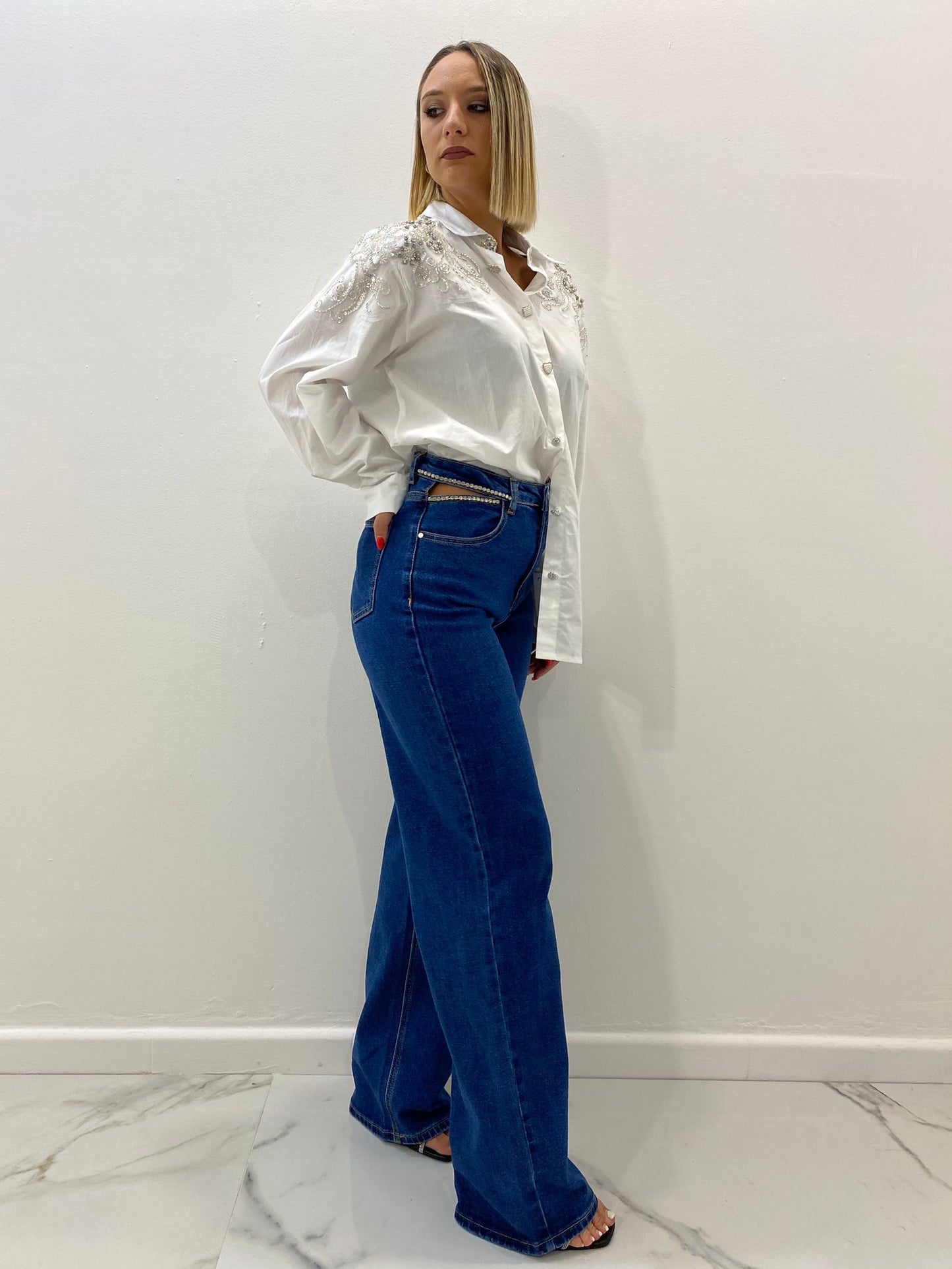 Jeans con aperture